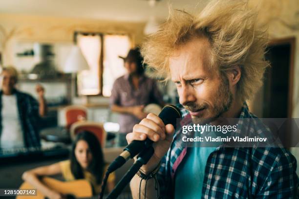 music band on rehearsal at home - woman hair band stock pictures, royalty-free photos & images