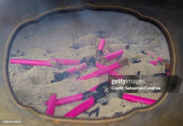 incense sticks burning, frame or light from burning red candles in chinese temple. - perfume japan stock pictures, royalty-free photos & images