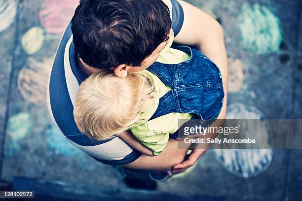 Father and son embracing