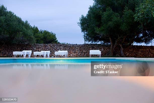 swimming pool in early evening - pool water surface stock pictures, royalty-free photos & images