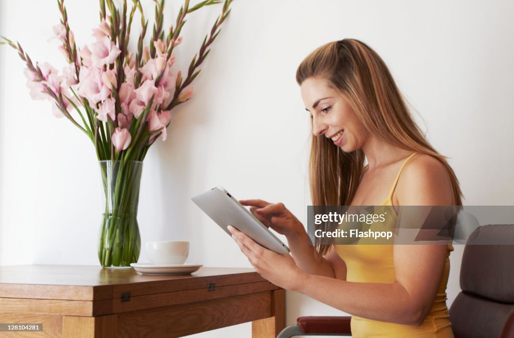 Woman using digital tablet