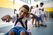 Portrait of student with disability in sports court at school