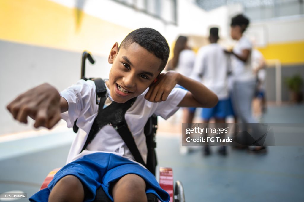 Portrait of student with disability in sports court at school