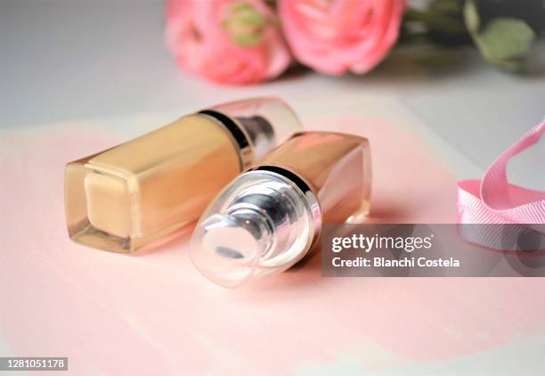 cosmetic makeup bottles on pink background - make up liquid stock pictures, royalty-free photos & images