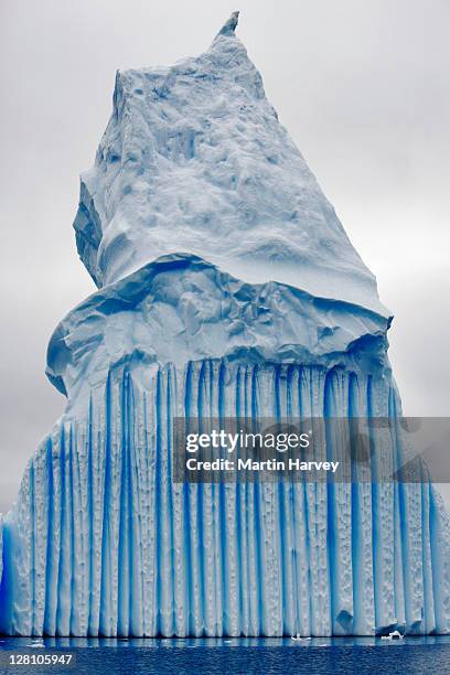 landscape with iceberg, a large piece of ice broken off from a snow-formed glacier or ice shelf and is floating in open water. around 90% of the volume is underwater. antarctica. - antarctica underwater stock pictures, royalty-free photos & images