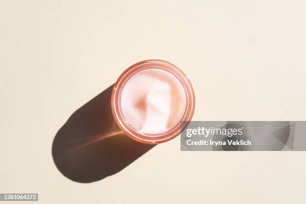 cosmetics product design of moisturizing cream, top view. - moisturiser stock pictures, royalty-free photos & images