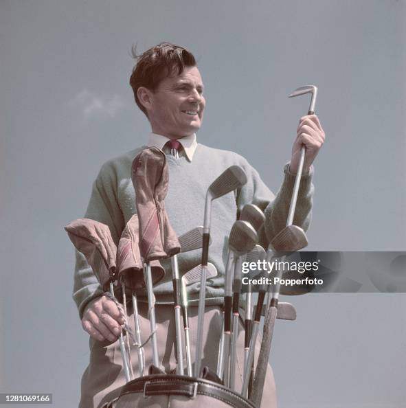 Dai Rees Atal Welsh golfer Dai Rees selects an iron club from his bag during a ...