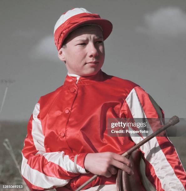 English professional jockey Lester Piggott posed in racing silks on the gallops at Lambourn in Berkshire, England in March 1951.