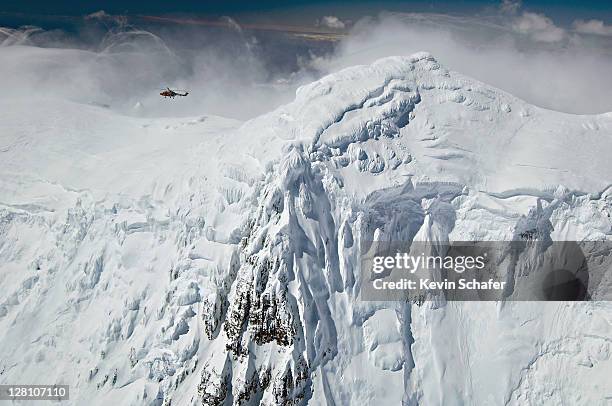 royal navy helicopter over mt. paget, highest peak on south georgia, december - polar caps stock pictures, royalty-free photos & images