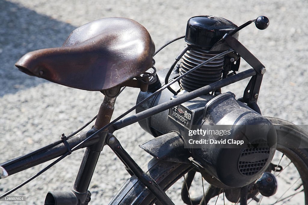 Old bicycle fitted with Hongdu engine, market in Kazimierz, Krakow, Poland