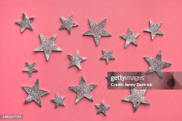 silver stars on pink - silverstars stock pictures, royalty-free photos & images