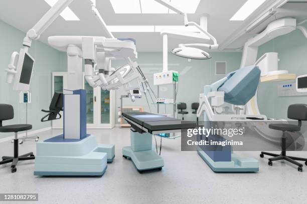 robotic surgery equipment in operation room - robot human arm stock pictures, royalty-free photos & images