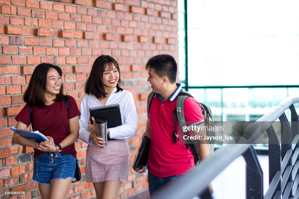 Adult student walking together in the campus