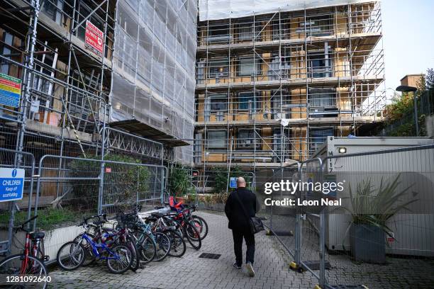 Man returns to his property, which is among those listed unsafe, on October 19, 2020 in Brentford, England. Paragon is a development of six apartment...