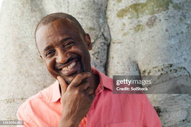 feeling confident - hand on chin stock pictures, royalty-free photos & images