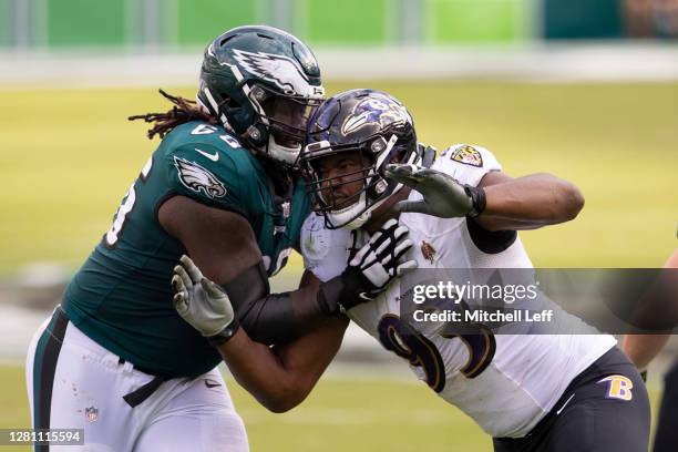 Jamon Brown of the Philadelphia Eagles attempts to block Calais Campbell of the Baltimore Ravens at Lincoln Financial Field on October 18, 2020 in...