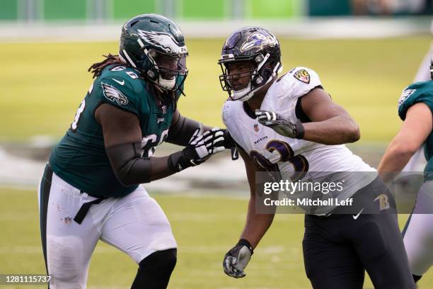 Jamon Brown of the Philadelphia Eagles attempts to block Calais Campbell of the Baltimore Ravens at Lincoln Financial Field on October 18, 2020 in...