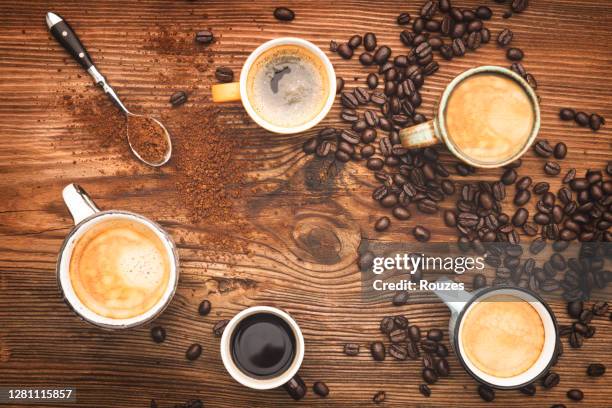 coffee cups collection,coffee in a row - espresso beans stock pictures, royalty-free photos & images
