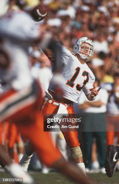 Gino Torretta,Quarterback for the University of Miami Hurricanes throws the football downfield during the NCAA Big East Conference college football...