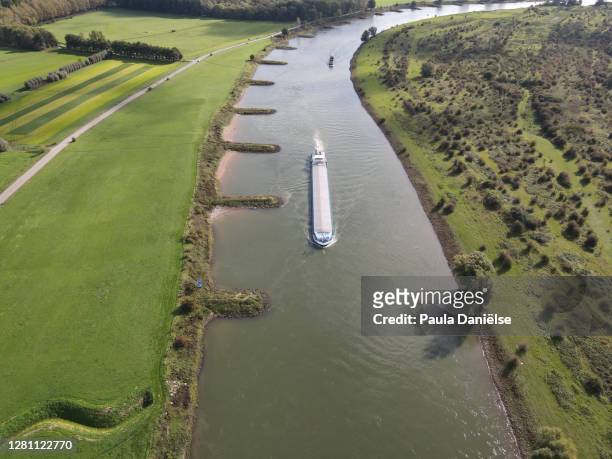 abstract aerial shot of a cargo boat on a river - gelderland bildbanksfoton och bilder