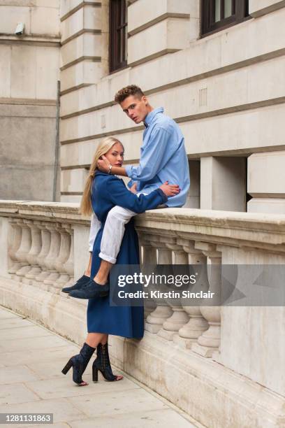 Influencer and model Lexi Fargo wears a Louis Vuitton coat, Orsay dress, runway Dior boots, and Chanel earrings with Model and Influencer Angus...