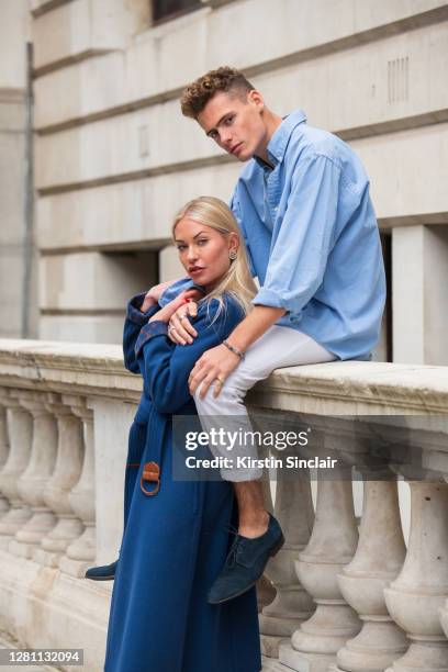 Influencer and model Lexi Fargo wears a Louis Vuitton coat, Orsay dress, runway Dior boots, and Chanel earrings with Model and Influencer Angus...