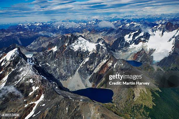 aerial view of andes mountains in tierra del fuego, land of fire. named so by the first explorer magallanes, after seeing smoke rising from indiginous fires on the shores. tierra del fuego national park, argentina - cordigliera delle ande foto e immagini stock