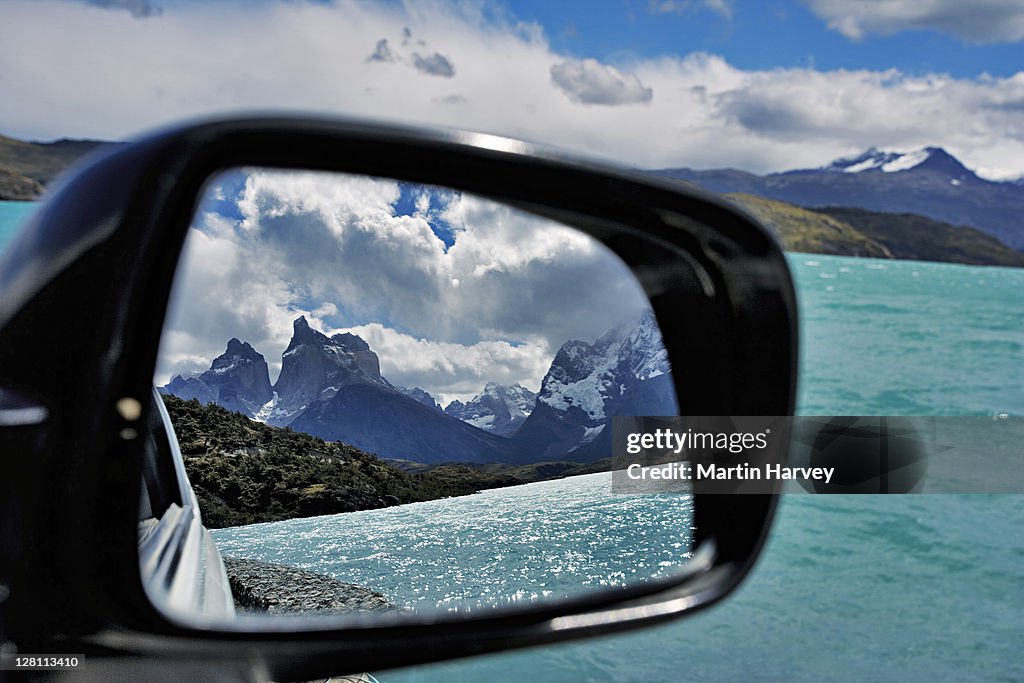 Los Cuernos and Lago Pehoè. Majestic snowcapped mountains, 'the Horns'and Lake Pehoè, reflected in car mirror. Torres del Paine National Park, Chile