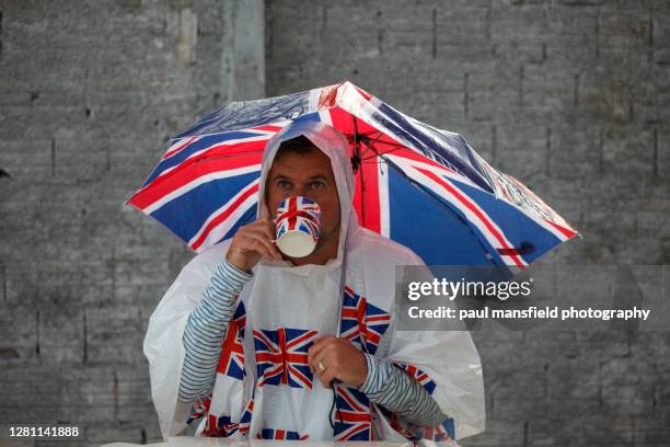 patriotic british man - union jack stock pictures, royalty-free photos & images