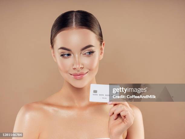 woman holding business card - loyalty cards stock pictures, royalty-free photos & images