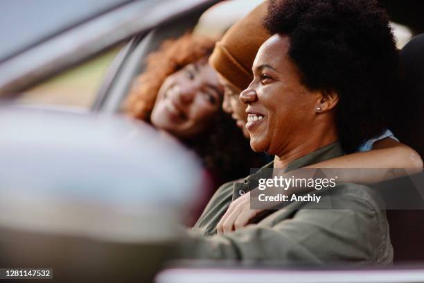 mother driving in car with her kids - daughter driving stock pictures, royalty-free photos & images