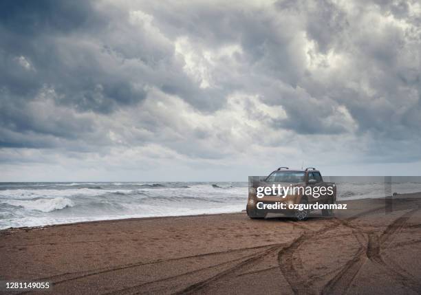 nissan np300 navara stopped on the beach near antalya, turkey - off road vehicle stock pictures, royalty-free photos & images