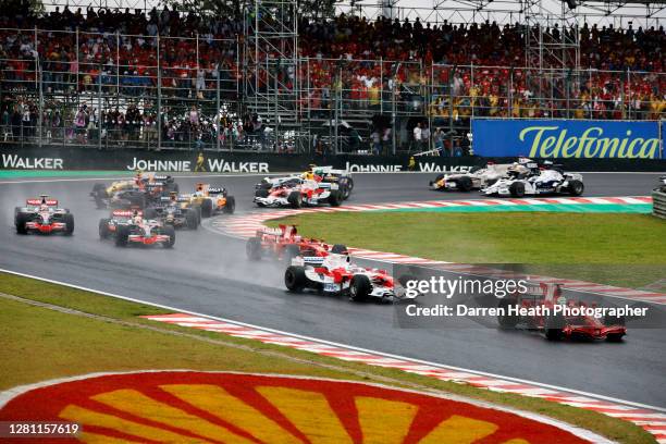 Brazilian Ferrari Formula One driver Felipe Massa leads the race through the first corner at the start of the 2008 Brazilian Grand Prix at the...