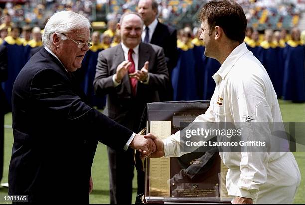 Australia captain Mark Taylor receives his 100th cap before the First Test against England at the GABBA in Brisbane, Australia. The match was drawn....