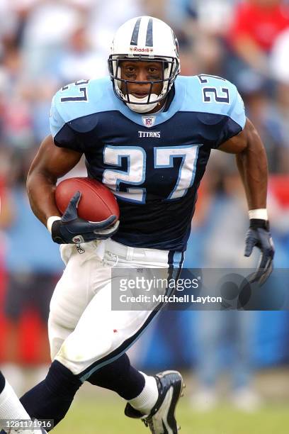 Eddie George of the Tennessee Titans runs with the ball during a NFL football game against the Washington Redskins on October 6, 2002 at FedExField...