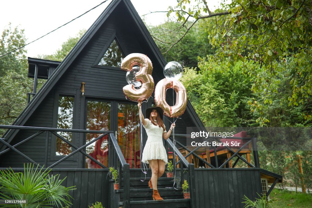 30 Years Birthday Party And Beautiful Woman in Front Of The Bungalow House