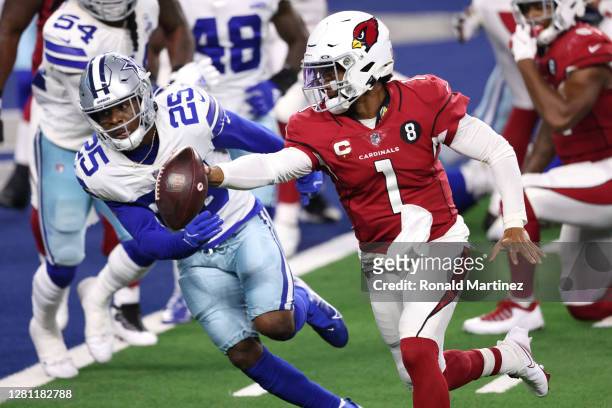 Kyler Murray of the Arizona Cardinals runs for a touchdown against Xavier Woods of the Dallas Cowboys during the third quarter at AT&T Stadium on...