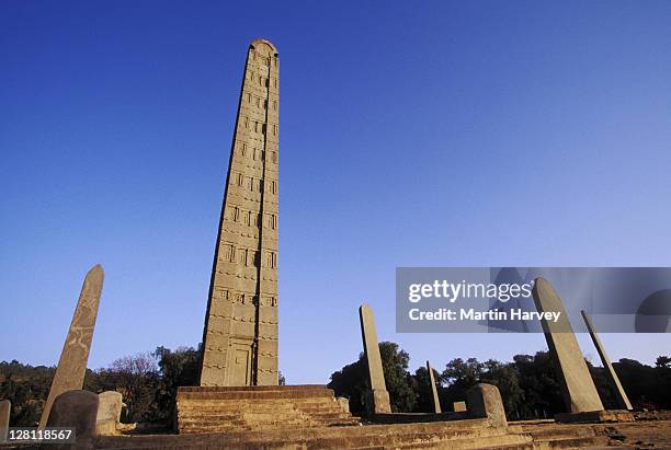 stele. 23m high block of solid granite accredited to king ezana, aksum. ethiopia. - obelisk stock pictures, royalty-free photos & images