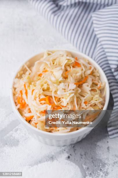 homemade sauerkraut in a plate. fermented cabbage in a bowl. - jäst bildbanksfoton och bilder