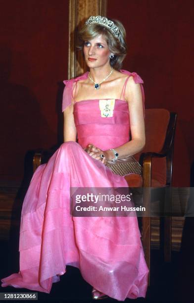 Diana, Princess of Wales, wearing a pink dress designed by Victor Edelstein, the Spencer tiara and the Royal family order of the Queen and Saudi...