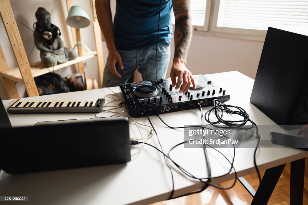 Dj and producer practicing at home