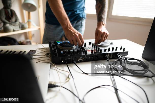 dj and producer practicing mixing music at home - electronic music stock pictures, royalty-free photos & images