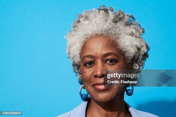 portrait of a confident, successful, happy mature woman - black woman grey hair stock pictures, royalty-free photos & images