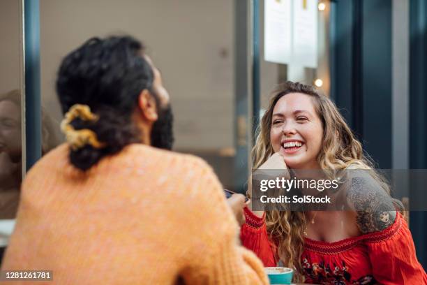 you're so funny! - coffee shop couple stock pictures, royalty-free photos & images