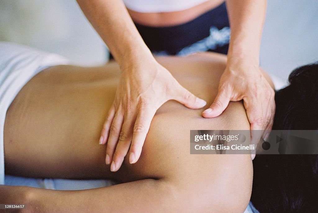 Woman receiving back massage