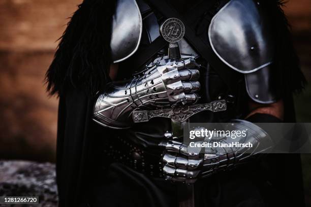 hand and sword of a medieval fantasy knight - knight stock pictures, royalty-free photos & images