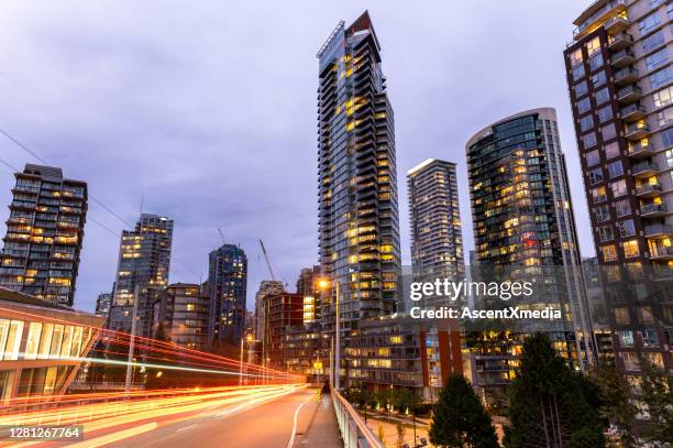 skyline of vancouver, bc at dusk - vancouver skyline stock pictures, royalty-free photos & images