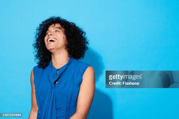 portrait of a confident, successful, happy mature woman - lachen stockfoto's en -beelden
