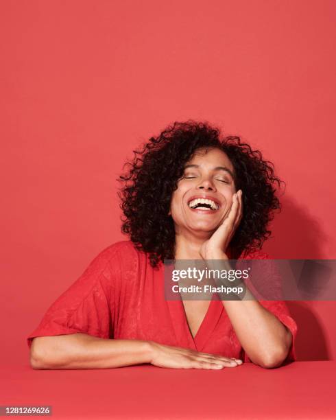 portrait of a confident, successful, happy mature woman - self satisfaction stock pictures, royalty-free photos & images