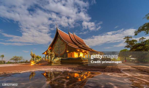 midnight scenics wat sirindhorn wararam temple ubonratchatani, thailand on night wat phu prao - wat stock pictures, royalty-free photos & images